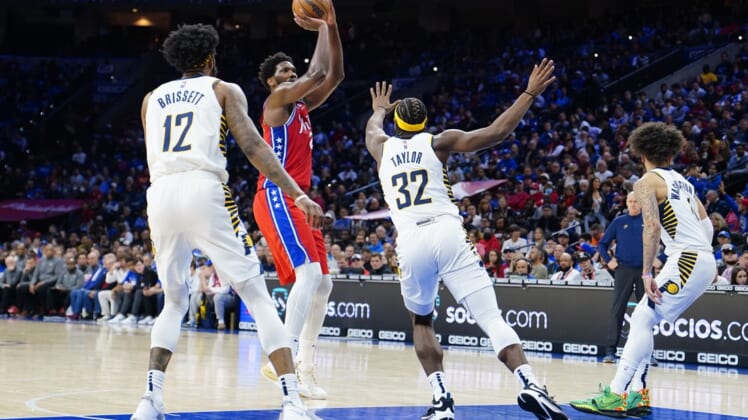 Apr 9, 2022; Philadelphia, Pennsylvania, USA; Philadelphia 76ers center Joel Embiid (21) shoots the ball against Indiana Pacers shooting guard Terry Taylor (32) during the second half at Wells Fargo Center. Mandatory Credit: Gregory Fisher-USA TODAY Sports