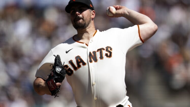 Apr 9, 2022; San Francisco, California, USA; San Francisco Giants starting pitcher Carlos Rodon (16) delivers a pitch against the Miami Marlins during the second inning at Oracle Park. Mandatory Credit: D. Ross Cameron-USA TODAY Sports