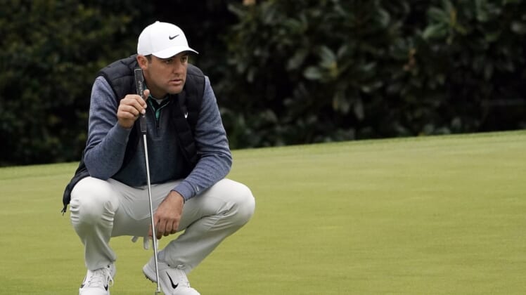 Apr 9, 2022; Augusta, Georgia, USA; Scottie Scheffler lines up a putt on no .5 during the third round of The Masters golf tournament at Augusta National Golf Club. Mandatory Credit: Katie Goodale-Augusta Chronicle/USA TODAY Sports