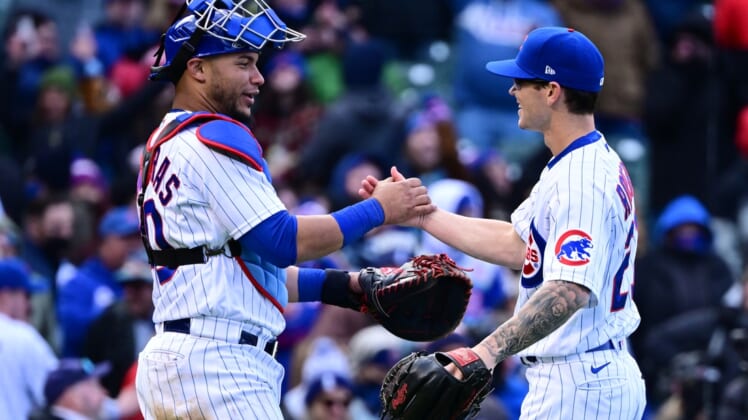 Apr 9, 2022; Chicago, Illinois, USA; Chicago Cubs catcher Willson Contreras (40) and Chicago Cubs relief pitcher Ethan Roberts (21) celebrate after securing the 9-0 win against the Milwaukee Brewers at Wrigley Field. Mandatory Credit: Quinn Harris-USA TODAY Sports