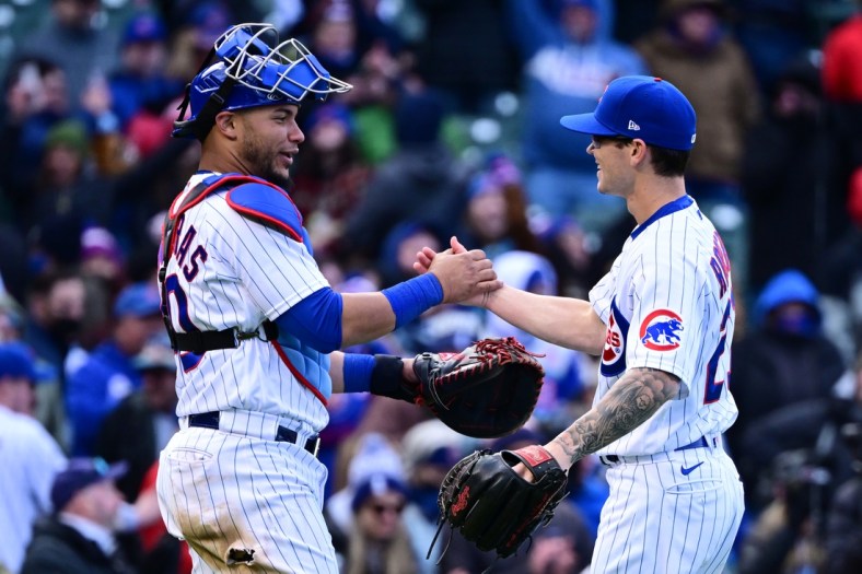 Apr 9, 2022; Chicago, Illinois, USA; Chicago Cubs catcher Willson Contreras (40) and Chicago Cubs relief pitcher Ethan Roberts (21) celebrate after securing the 9-0 win against the Milwaukee Brewers at Wrigley Field. Mandatory Credit: Quinn Harris-USA TODAY Sports