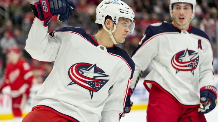 Apr 9, 2022; Detroit, Michigan, USA; Columbus Blue Jackets center Jack Roslovic (96) celebrates after scoring a goal during the first period against the Detroit Red Wings at Little Caesars Arena. Mandatory Credit: Raj Mehta-USA TODAY Sports