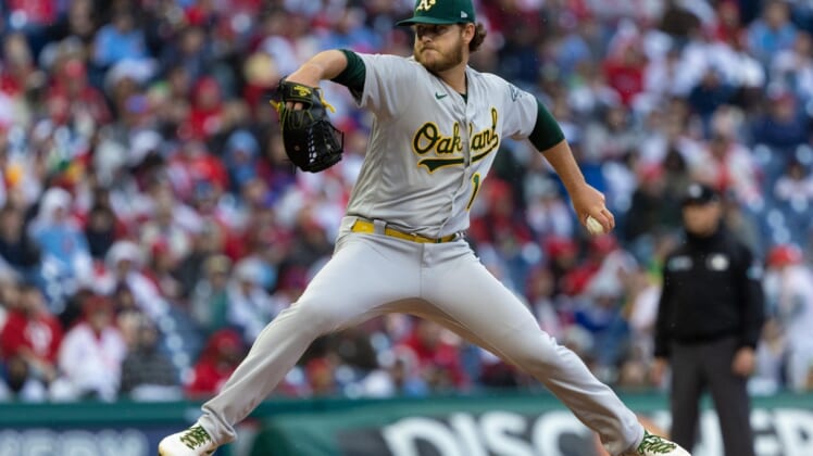 Apr 9, 2022; Philadelphia, Pennsylvania, USA; Oakland Athletics starting pitcher Cole Irvin (19) throws a pitch against the Philadelphia Phillies at Citizens Bank Park. Mandatory Credit: Bill Streicher-USA TODAY Sports