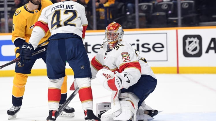 Apr 9, 2022; Nashville, Tennessee, USA; Florida Panthers goaltender Spencer Knight (30) watches as the puck goes wide of the net during the first period against the Nashville Predators at Bridgestone Arena. Mandatory Credit: Christopher Hanewinckel-USA TODAY Sports
