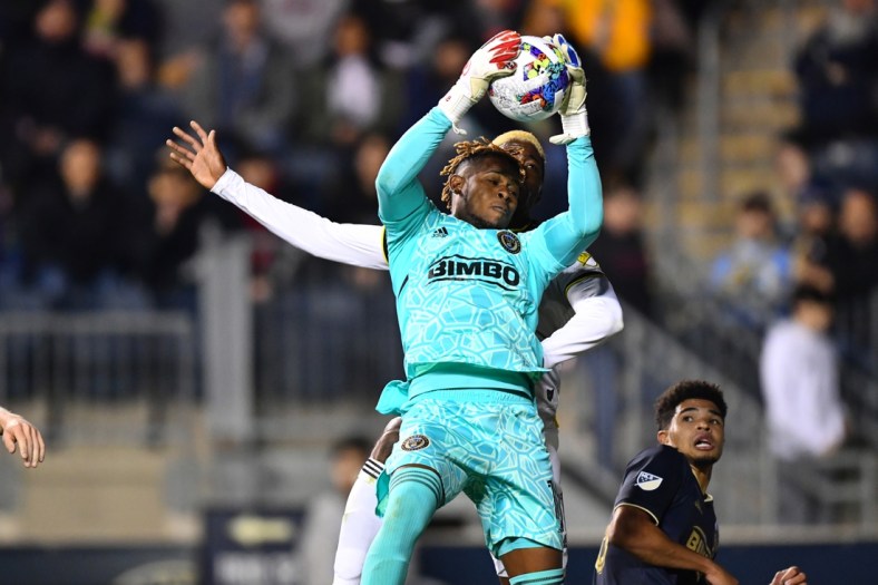 Apr 9, 2022; Philadelphia, Pennsylvania, USA; Philadelphia Union keeper Andre Blake (18) catches the ball in front of Columbus Crew forward Gyasi Zardes (11) in the second half at Subaru Park. Mandatory Credit: Kyle Ross-USA TODAY Sports