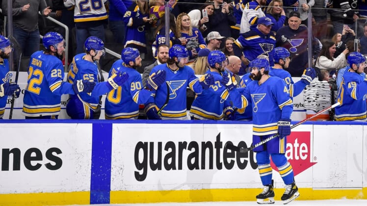 Apr 9, 2022; St. Louis, Missouri, USA;  St. Louis Blues defenseman Nick Leddy (4) is congratulated by teammates after scoring against the New York Islanders during the first period at Enterprise Center. Mandatory Credit: Jeff Curry-USA TODAY Sports