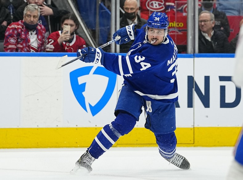 Apr 9, 2022; Toronto, Ontario, CAN; Toronto Maple Leafs forward Auston Matthews (34) shoots the puck against the Montreal Canadiens during the third period at Scotiabank Arena. Mandatory Credit: John E. Sokolowski-USA TODAY Sports