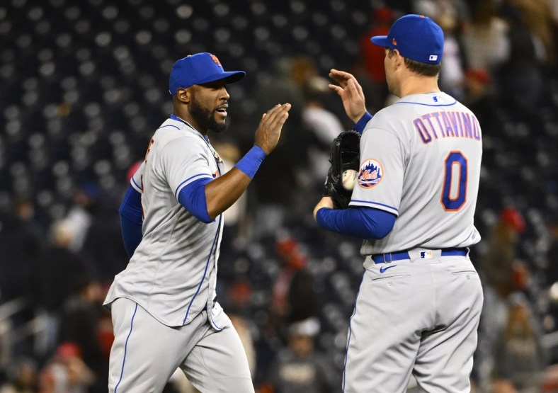 Apr 9, 2022; Washington, District of Columbia, USA; New York Mets center fielder Starling Marte (6) celebrates with relief pitcher Adam Ottavino (0) after the game against the Washington Nationals at Nationals Park. Mandatory Credit: Brad Mills-USA TODAY Sports