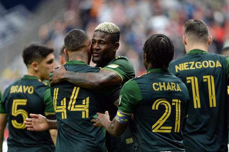 Apr 9, 2022; Vancouver, British Columbia, CAN;  Portland Timbers forward Dairon Asprilla (27) celebrates with teammates after scoring on a penalty kick against the Vancouver Whitecaps during the first half at BC Place. Mandatory Credit: Anne-Marie Sorvin-USA TODAY Sports