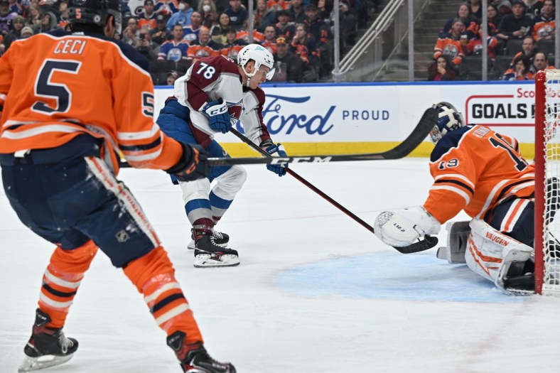 Apr 9, 2022; Edmonton, Alberta, CAN;  Colorado Avalanche centre Nico Sturm (78) shoots the puck against Edmonton Oilers goalie Mikko Koskinen (19) during the second period at Rogers Place. Mandatory Credit: Walter Tychnowicz-USA TODAY Sports