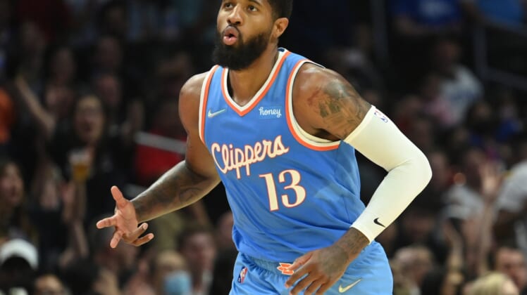 Apr 9, 2022; Los Angeles, California, USA; Los Angeles Clippers guard Paul George (13) runs down court after a three point basket against the Sacramento Kings in the second half at Crypto.com Arena. Mandatory Credit: Jayne Kamin-Oncea-USA TODAY Sports