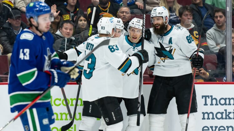 Apr 9, 2022; Vancouver, British Columbia, CAN;  San Jose Sharks center Nick Bonino (13) celebrates after scoring a goal as Vancouver Canucks defenseman Quinn Hughes (43) skates by in the second period at Rogers Arena. Mandatory Credit: Derek Cain-USA TODAY Sports