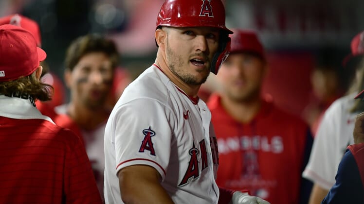 Apr 9, 2022; Anaheim, California, USA; Los Angeles Angels center fielder Mike Trout (27) celebrates his solo home run hit against the Houston Astros during the eighth inning at Angel Stadium. Mandatory Credit: Gary A. Vasquez-USA TODAY Sports