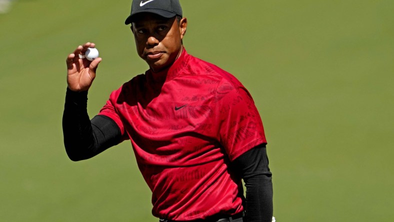 Apr 10, 2022; Augusta, Georgia, USA; Tiger Woods reacts to his putt on the second green during the final round of the Masters golf tournament. Mandatory Credit: Rob Schumacher-USA TODAY Sports