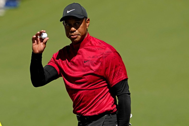 Apr 10, 2022; Augusta, Georgia, USA; Tiger Woods reacts to his putt on the second green during the final round of the Masters golf tournament. Mandatory Credit: Rob Schumacher-USA TODAY Sports