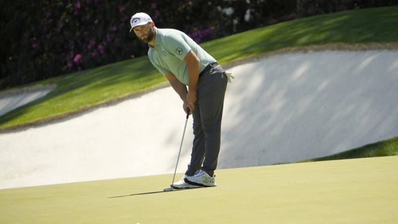 Apr 10, 2022; Augusta, Georgia, USA; Jon Rahm putts on no. 13 during the final round of the Masters Tournament at Augusta National Golf Club. Mandatory Credit: Adam Cairns-Augusta Chronicle/USA TODAY Sports