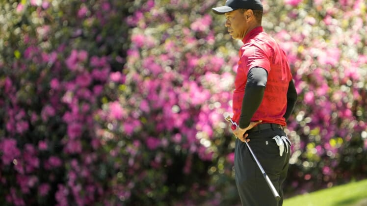 Apr 10, 2022; Augusta, Georgia, USA; Tiger Woods stands on the no. 13 green during the final round of the Masters Tournament at Augusta National Golf Club. Mandatory Credit: Adam Cairns-Augusta Chronicle/USA TODAY Sports
