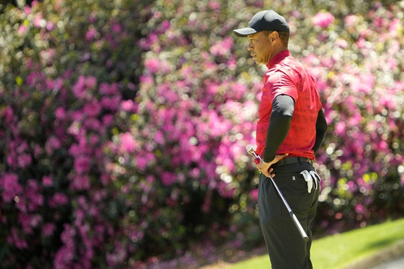 Apr 10, 2022; Augusta, Georgia, USA; Tiger Woods stands on the no. 13 green during the final round of the Masters Tournament at Augusta National Golf Club. Mandatory Credit: Adam Cairns-Augusta Chronicle/USA TODAY Sports