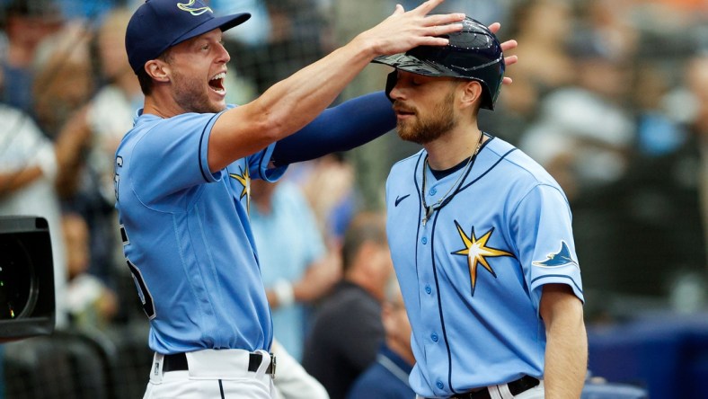 Apr 10, 2022; St. Petersburg, Florida, USA;  Tampa Bay Rays second baseman Brandon Lowe (8) is greeted by right fielder Brett Phillips (35) after hitting a two run home run against the Baltimore Orioles in the second inning at Tropicana Field. Mandatory Credit: Nathan Ray Seebeck-USA TODAY Sports