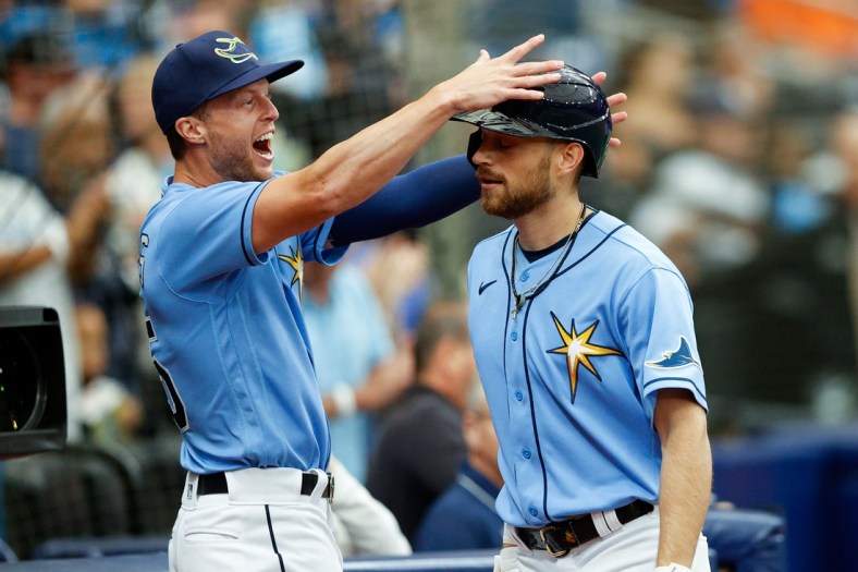 Apr 10, 2022; St. Petersburg, Florida, USA;  Tampa Bay Rays second baseman Brandon Lowe (8) is greeted by right fielder Brett Phillips (35) after hitting a two run home run against the Baltimore Orioles in the second inning at Tropicana Field. Mandatory Credit: Nathan Ray Seebeck-USA TODAY Sports