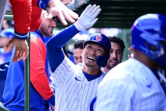 Apr 10, 2022; Chicago, Illinois, USA; Chicago Cubs right fielder Seiya Suzuki (27) celebrates in the dugout with teammates after his three run home run in the first inning against the Milwaukee Brewers at Wrigley Field. Mandatory Credit: Quinn Harris-USA TODAY Sports