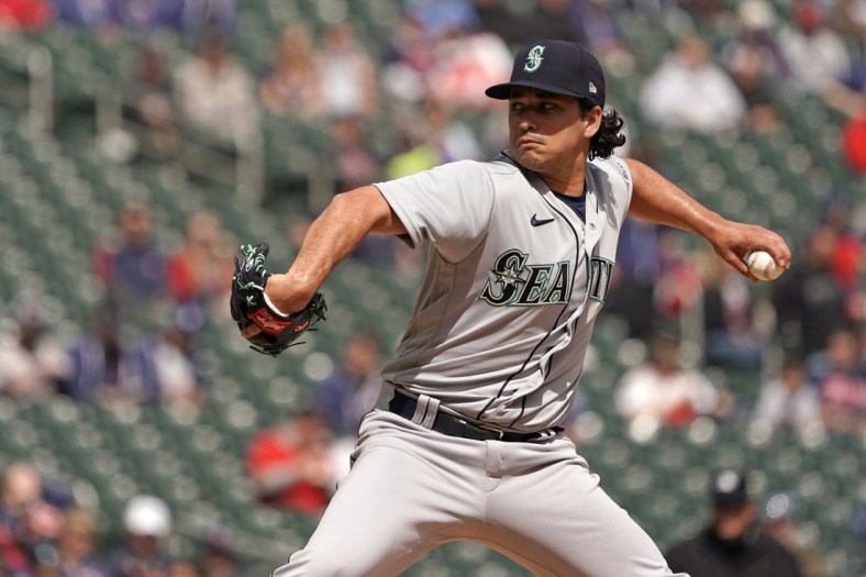 Apr 10, 2022; Minneapolis, Minnesota, USA; Seattle Mariners starting pitcher Marco Gonzales (7) delivers a pitch against the Minnesota Twins during the second inning at Target Field. Mandatory Credit: Nick Wosika-USA TODAY Sports