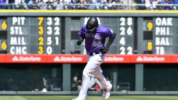 Apr 10, 2022; Denver, Colorado, USA; Colorado Rockies first baseman C.J. Cron (25) rounds second base after hitting a two-run home run in the third inning against the Los Angeles Dodgers at Coors Field. Mandatory Credit: John Leyba-USA TODAY Sports