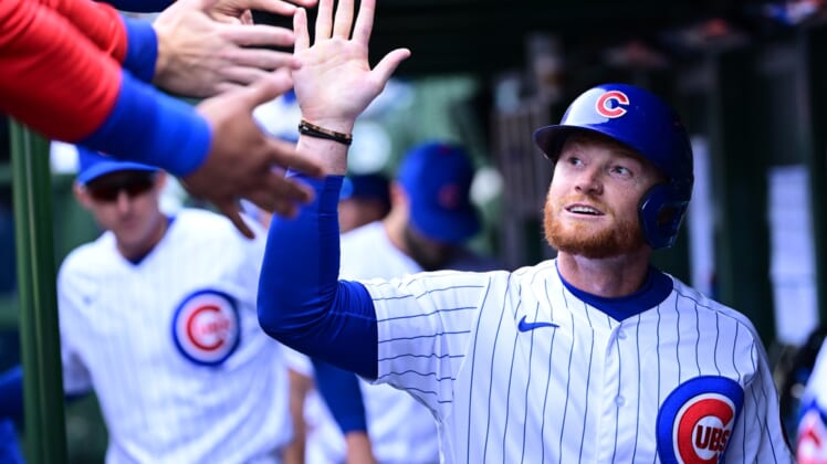 Apr 10, 2022; Chicago, Illinois, USA; Chicago Cubs left fielder Clint Frazier (77) celebrates with teammates after scoring in the sixth inning against the Milwaukee Brewers at Wrigley Field. Mandatory Credit: Quinn Harris-USA TODAY Sports