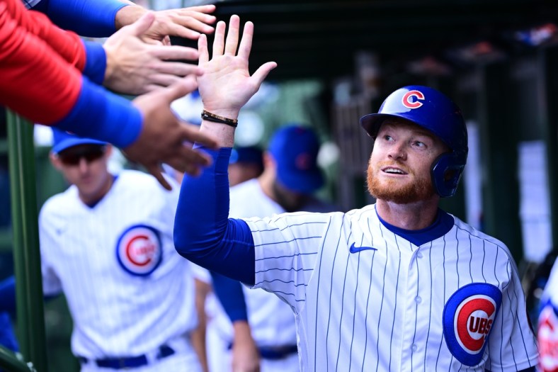 Apr 10, 2022; Chicago, Illinois, USA; Chicago Cubs left fielder Clint Frazier (77) celebrates with teammates after scoring in the sixth inning against the Milwaukee Brewers at Wrigley Field. Mandatory Credit: Quinn Harris-USA TODAY Sports