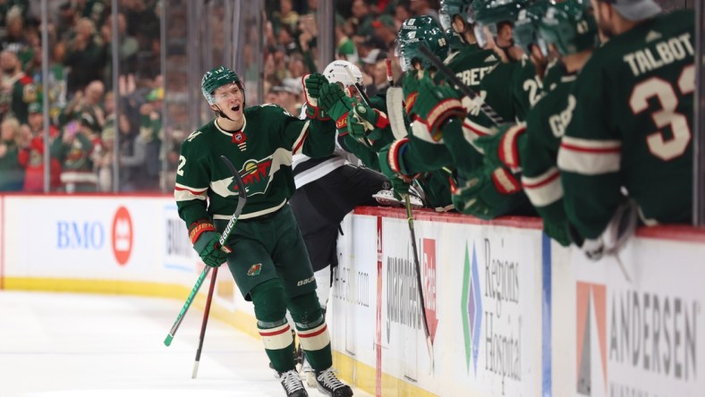 Apr 10, 2022; Saint Paul, Minnesota, USA; Minnesota Wild left wing Matt Boldy (12) celebrates a first period goal against the Los Angeles Kings at Xcel Energy Center. Mandatory Credit: Matt Krohn-USA TODAY Sports