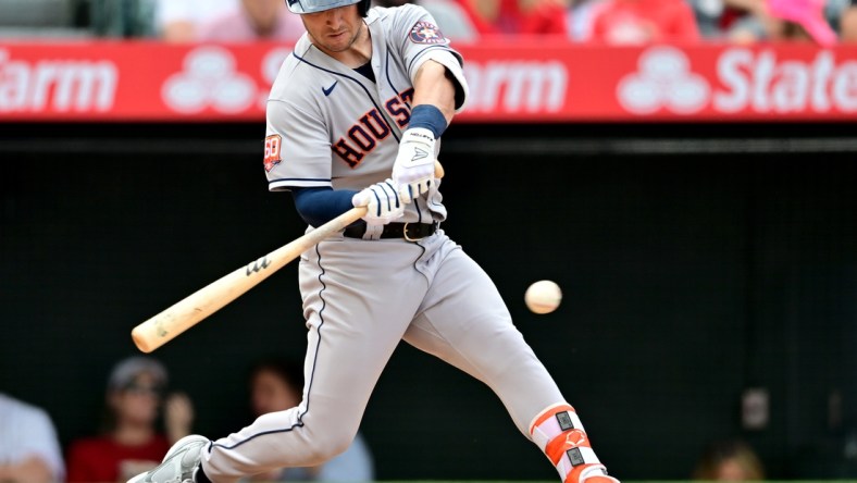 Apr 10, 2022; Anaheim, California, USA;  Houston Astros third baseman Alex Bregman (2) doubles in two runs in the fifth inning of the game against the Los Angeles Angels at Angel Stadium. Mandatory Credit: Jayne Kamin-Oncea-USA TODAY Sports