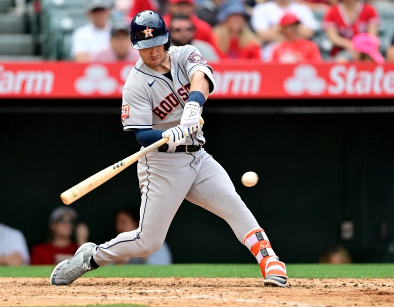 Apr 10, 2022; Anaheim, California, USA;  Houston Astros third baseman Alex Bregman (2) doubles in two runs in the fifth inning of the game against the Los Angeles Angels at Angel Stadium. Mandatory Credit: Jayne Kamin-Oncea-USA TODAY Sports
