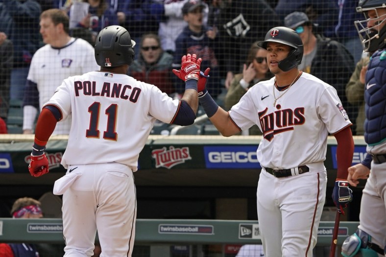 Apr 10, 2022; Minneapolis, Minnesota, USA; Minnesota Twins second base Jorge Polanco (11) celebrates his solo home run off of Seattle Mariners relief pitcher Matthew Festa (not pictured) with right fielder Alex Kirilloff (19) during the fourth inning at Target Field. Mandatory Credit: Nick Wosika-USA TODAY Sports