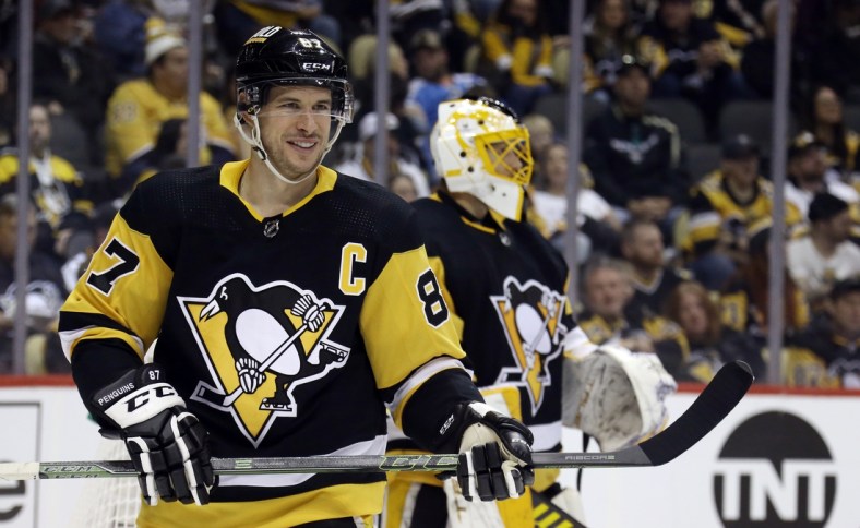 Apr 10, 2022; Pittsburgh, Pennsylvania, USA;  Pittsburgh Penguins center Sidney Crosby (87) reacts before a face-off against the Nashville Predators during the third period at PPG Paints Arena. The Penguins won 3-2 in overtime. Mandatory Credit: Charles LeClaire-USA TODAY Sports