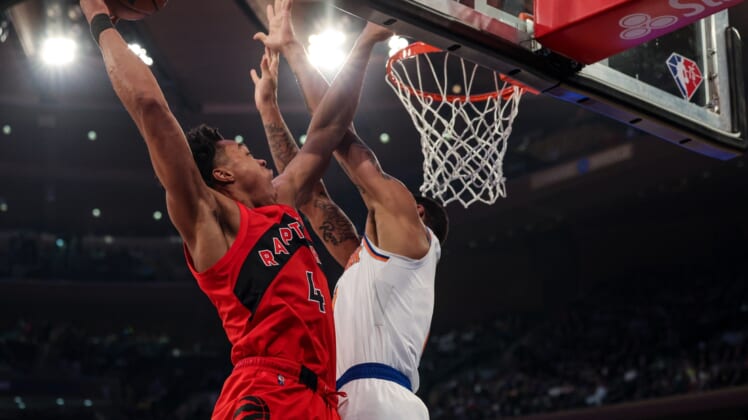 Apr 10, 2022; New York, New York, USA; Toronto Raptors forward Scottie Barnes (4) drives to the basket against New York Knicks forward Obi Toppin (1) during the first half at Madison Square Garden. Mandatory Credit: Vincent Carchietta-USA TODAY Sports