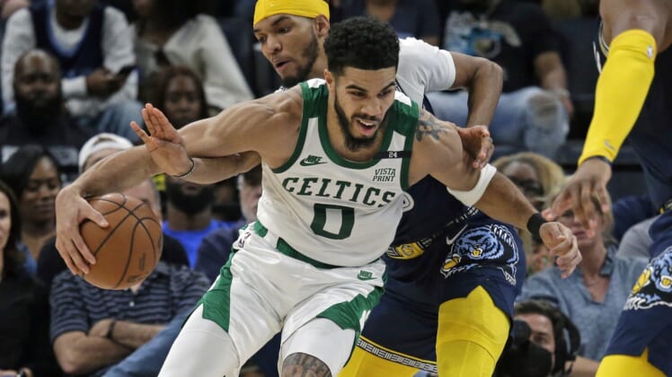 Apr 10, 2022; Memphis, Tennessee, USA; Boston Celtics forward Jayson Tatum (0) drives to the basket as Memphis Grizzlies forward Ziaire Williams (8) defends during the first half at FedExForum. Mandatory Credit: Petre Thomas-USA TODAY Sports