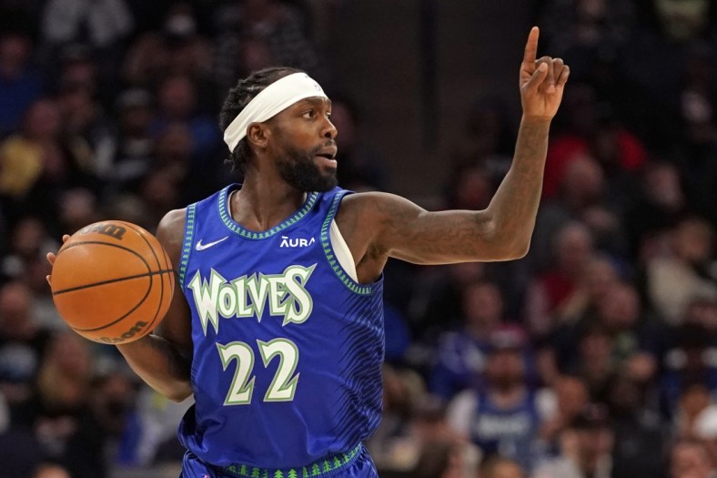 Apr 10, 2022; Minneapolis, Minnesota, USA; Minnesota Timberwolves guard Patrick Beverley (22) calls a play as he brings the ball up-court against the Chicago Bulls during the first quarter at Target Center. Mandatory Credit: Nick Wosika-USA TODAY Sports