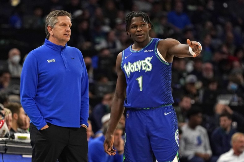 Apr 10, 2022; Minneapolis, Minnesota, USA;  Minnesota Timberwolves head coach Chris Finch and guard Anthony Edwards (1) discus the previous play against the Chicago Bulls during the second quarter at Target Center. Mandatory Credit: Nick Wosika-USA TODAY Sports