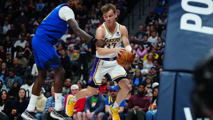 Apr 10, 2022; Denver, Colorado, USA; Los Angeles Lakers guard Mac McClung (37) and Denver Nuggets forward JaMychal Green (0) during the second quarter at Ball Arena. Mandatory Credit: Ron Chenoy-USA TODAY Sports