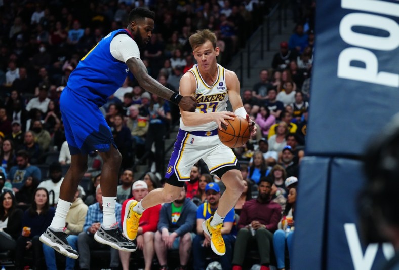 Apr 10, 2022; Denver, Colorado, USA; Los Angeles Lakers guard Mac McClung (37) and Denver Nuggets forward JaMychal Green (0) during the second quarter at Ball Arena. Mandatory Credit: Ron Chenoy-USA TODAY Sports