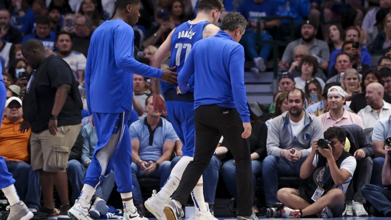 Apr 10, 2022; Dallas, Texas, USA; Dallas Mavericks guard Luka Doncic (77) walks off the court injured during the second half against the San Antonio Spurs at American Airlines Center. Mandatory Credit: Kevin Jairaj-USA TODAY Sports