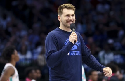 Apr 10, 2022; Dallas, Texas, USA;  Dallas Mavericks guard Luka Doncic (77) speaks to the crowd before the game against the San Antonio Spurs at American Airlines Center. Mandatory Credit: Kevin Jairaj-USA TODAY Sports