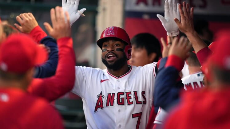 Apr 11, 2022; Anaheim, California, USA; Los Angeles Angels left fielder Jo Adell (7) is congratulated in the dugout after hitting a home run during the second inning against the Miami Marlins at Angel Stadium. Mandatory Credit: Kirby Lee-USA TODAY Sports