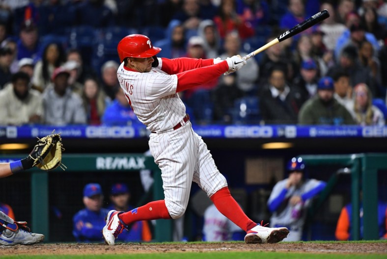 Apr 11, 2022; Philadelphia, Pennsylvania, USA; Philadelphia Phillies first baseman Rhys Hoskins (17) hits an RBI double in the eighth inning against the New York Mets at Citizens Bank Park. Mandatory Credit: Kyle Ross-USA TODAY Sports