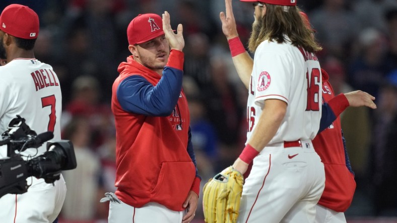 Apr 11, 2022; Anaheim, California, USA; Los Angeles Angels center fielder Mike Trout (27) celebrates with left fielder Brandon Marsh (16) after defeating the Miami Marlins at Angel Stadium. Mandatory Credit: Kirby Lee-USA TODAY Sports