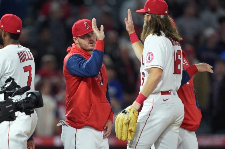 Apr 11, 2022; Anaheim, California, USA; Los Angeles Angels center fielder Mike Trout (27) celebrates with left fielder Brandon Marsh (16) after defeating the Miami Marlins at Angel Stadium. Mandatory Credit: Kirby Lee-USA TODAY Sports