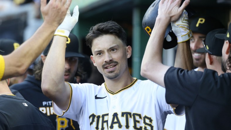 Apr 12, 2022; Pittsburgh, Pennsylvania, USA;  Pittsburgh Pirates left fielder Bryan Reynolds (10) celebrates his solo home run against the Chicago Cubs during the eighth inning at PNC Park. Mandatory Credit: Charles LeClaire-USA TODAY Sports