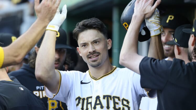 Apr 12, 2022; Pittsburgh, Pennsylvania, USA;  Pittsburgh Pirates left fielder Bryan Reynolds (10) celebrates his solo home run against the Chicago Cubs during the eighth inning at PNC Park. Mandatory Credit: Charles LeClaire-USA TODAY Sports