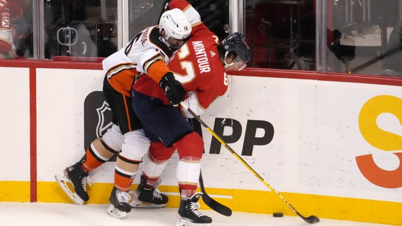 Apr 12, 2022; Sunrise, Florida, USA; Anaheim Ducks center Zach Aston-Reese (16) battles Florida Panthers defenseman Brandon Montour (62) for the puck during the first period at FLA Live Arena. Mandatory Credit: Jasen Vinlove-USA TODAY Sports