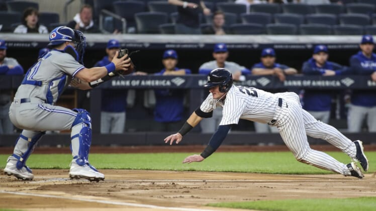 Apr 12, 2022; Bronx, New York, USA;  New York Yankees third baseman Josh Donaldson (28) attempts to score a run in the first inning against the Toronto Blue Jays  at Yankee Stadium. Mandatory Credit: Wendell Cruz-USA TODAY Sports